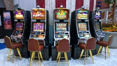 Push Gaming slot interface on kds showing reel layout, stake controls, and balance display